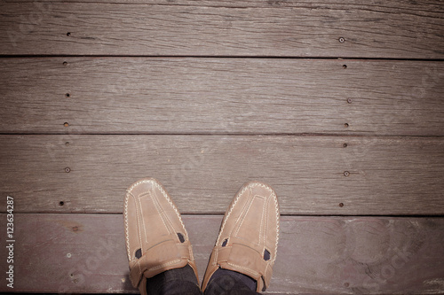 Man shoes with copy space on wooden floor background