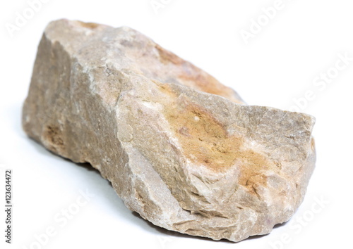 Single natural stone on white background