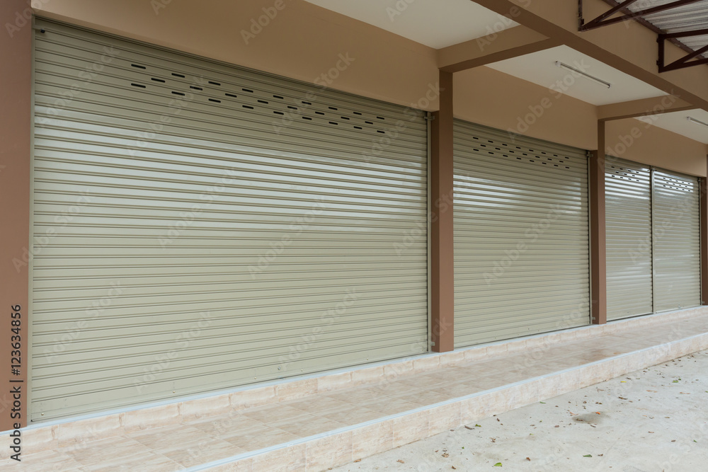 Fototapeta premium roller shutter door in warehouse building