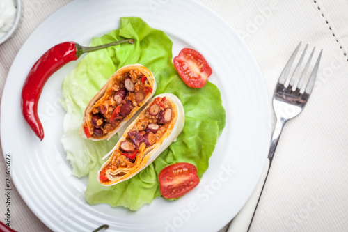 Burritos filled wiht minced meat, bean and vegetables.