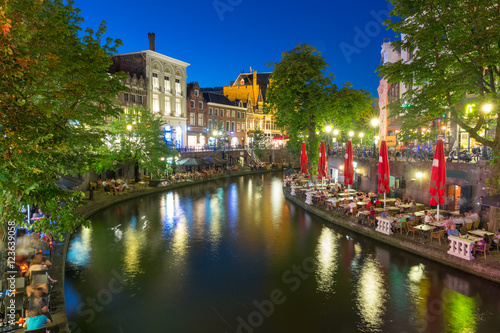 Canal Oudegracht in the colorful illuminations at night, Utrecht, Netherlands © Kavalenkava