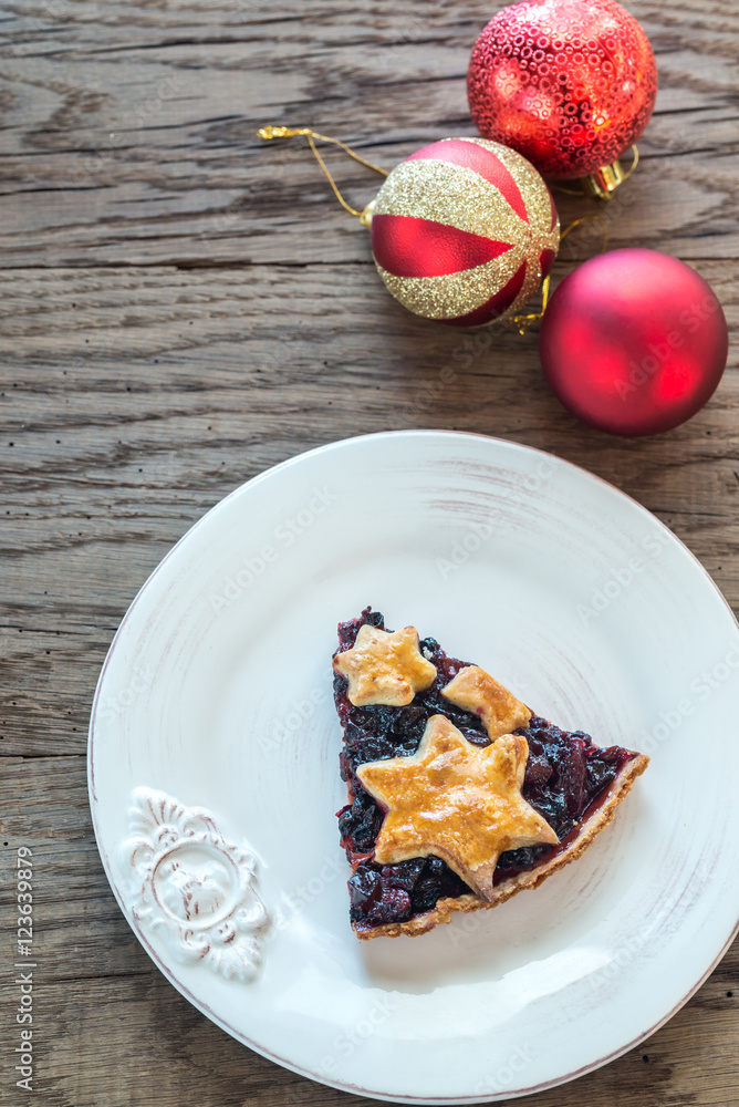 Portion of mince pie on the wooden background Portion of mince pie on the wooden background