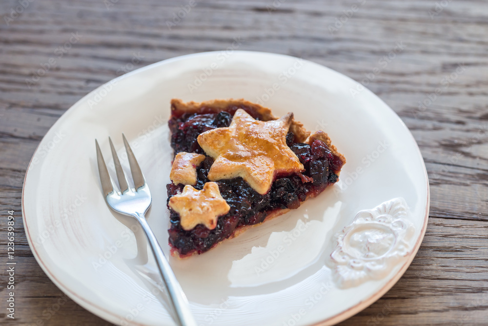 Portion of mince pie on the wooden background Portion of mince pie on the wooden background