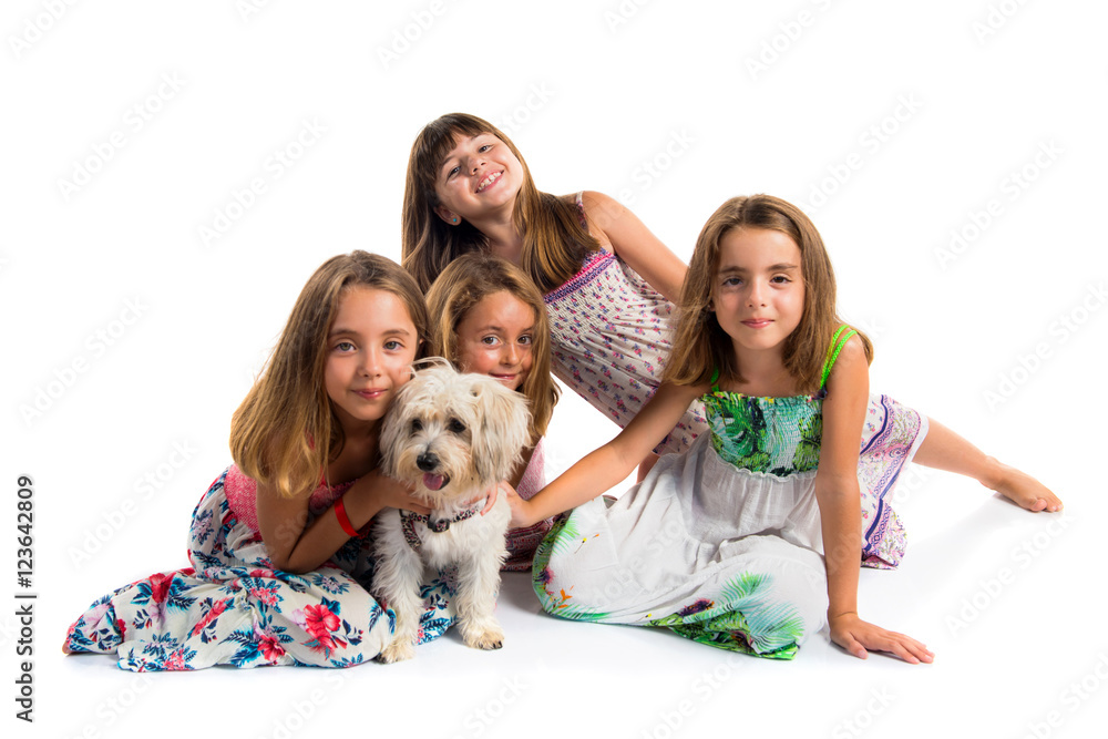 Group of girls playing with a dog Group of girls playing with a dog