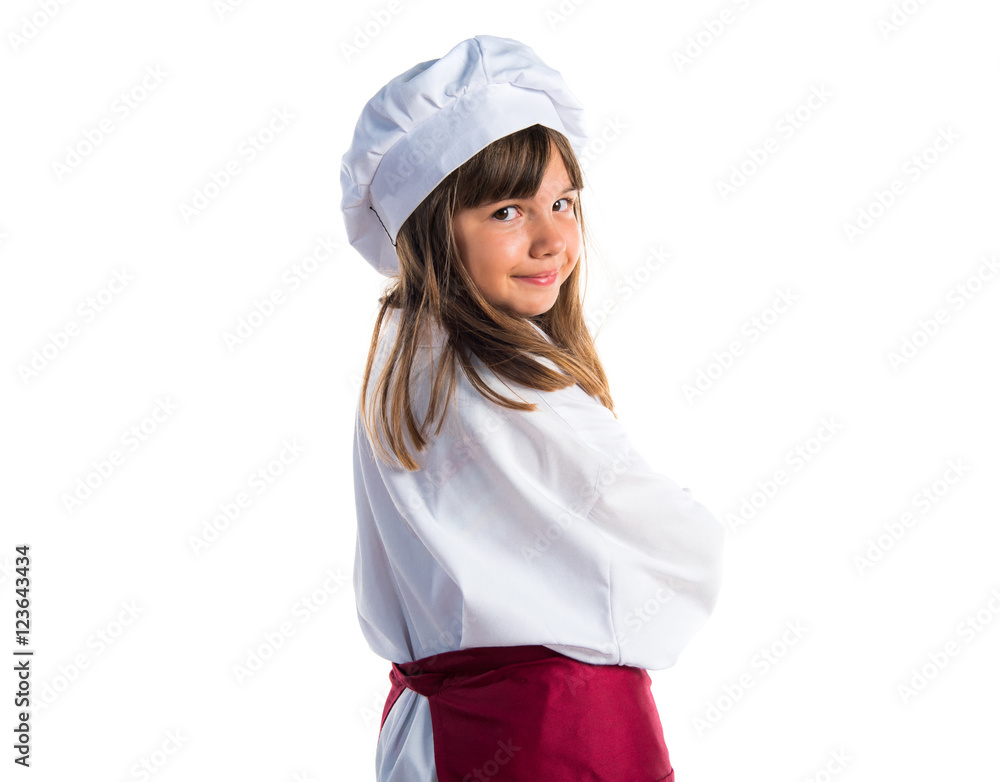 Little cute girl dressed like a chef with his arms crossed Little cute girl dressed like a chef with his arms crossed