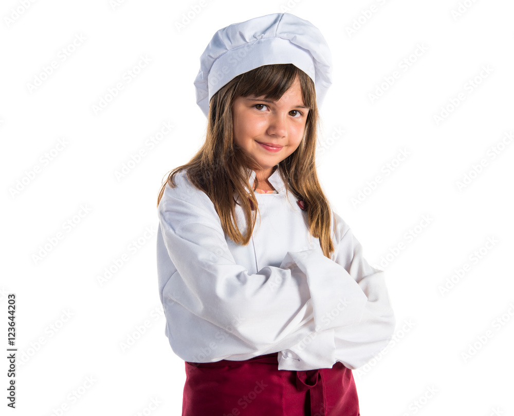 Little cute girl dressed like a chef with his arms crossed Little cute girl dressed like a chef with his arms crossed