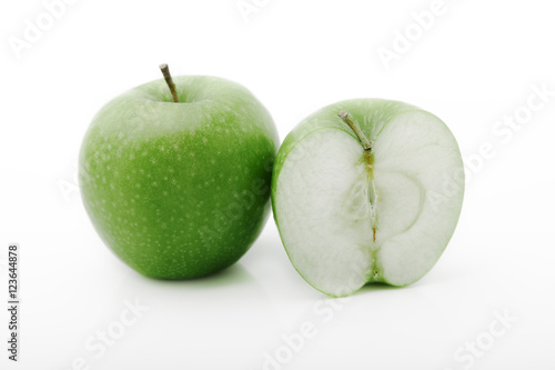 Juicy green apples on the white background
