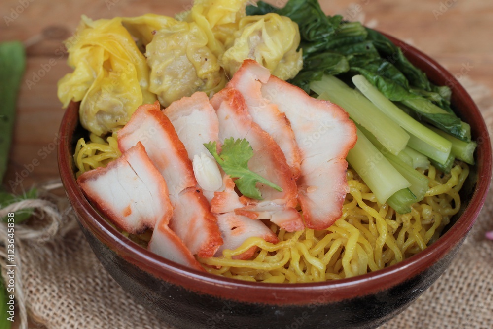 Egg noodles with pork and dumpling is delicious. Egg noodles with pork and dumpling is delicious.