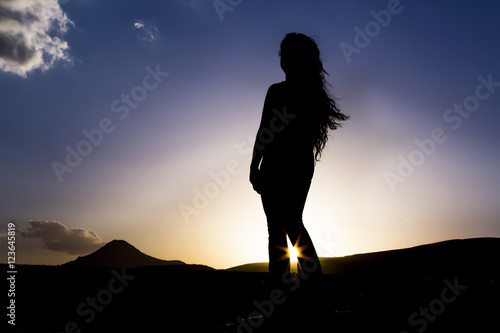 silhouette girl at sun
