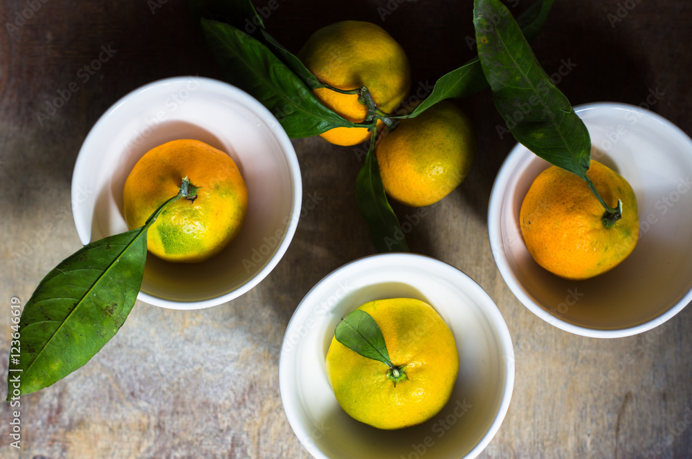 ripe tangerine with green leaves ripe tangerine with green leaves