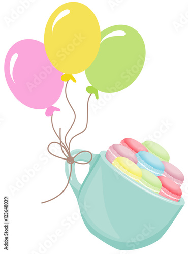 Macaroons flying in cup with balloons
