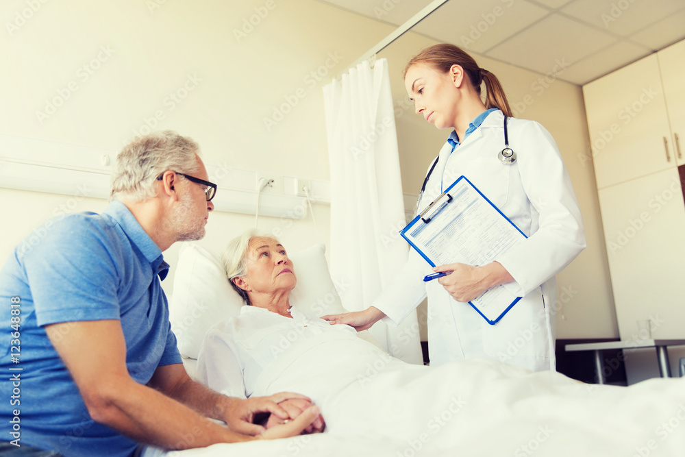 senior woman and doctor with clipboard at hospital senior woman and doctor with clipboard at hospital