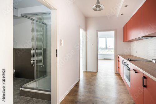 Empty room with domestic kitchen and bathroom