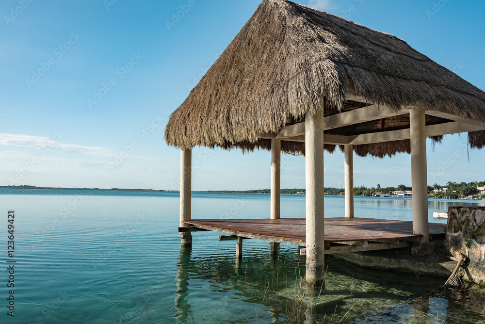 pavilion with thatched roof at laguna of bacalar