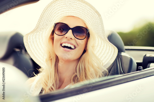 happy woman driving in cabriolet car © Syda Productions