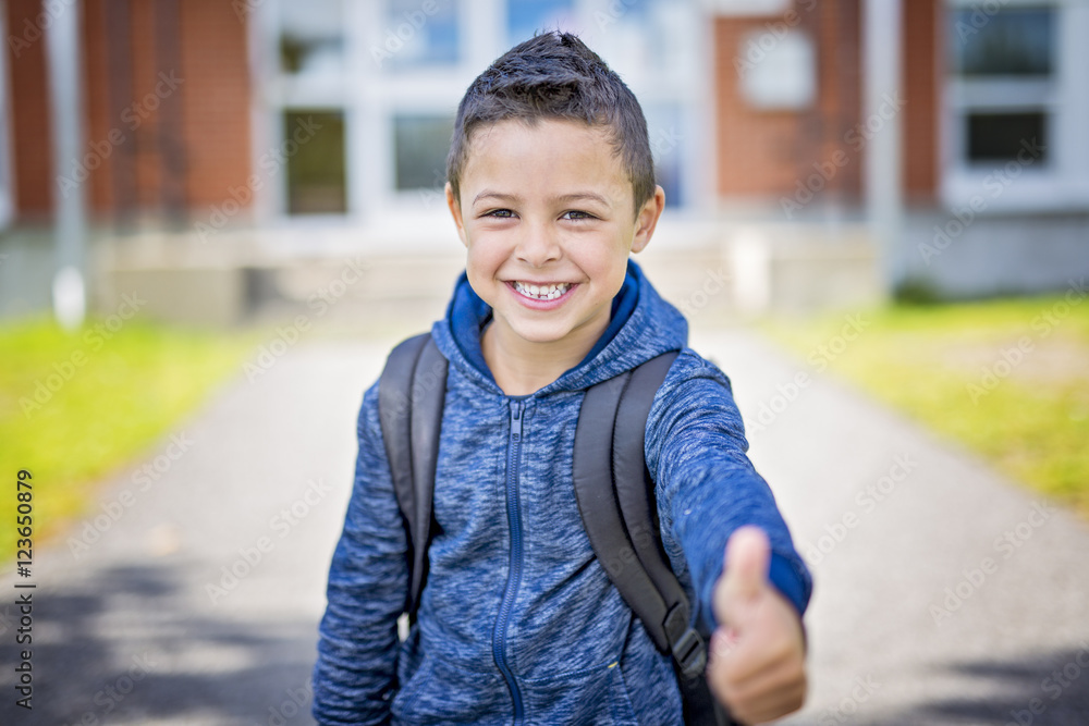 student outside school standing smiling student outside school standing smiling