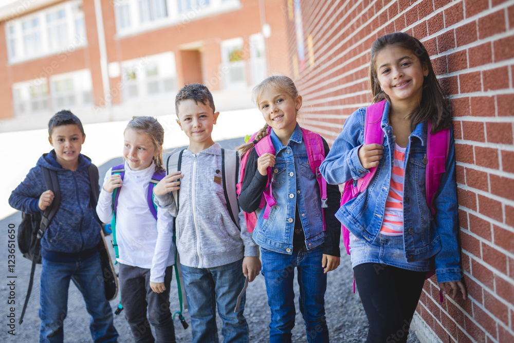 Fototapeta premium students outside school standing together