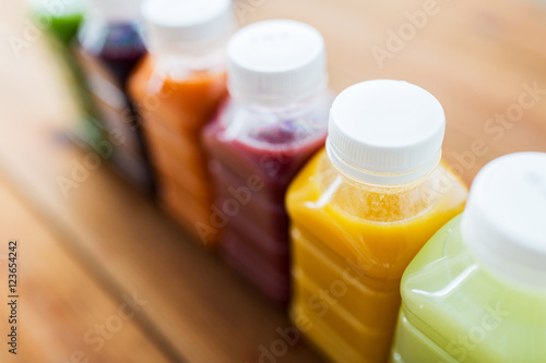 bottles with different fruit or vegetable juices