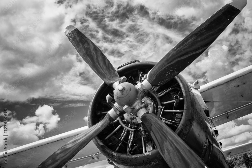 Close up of old airplane in black and white