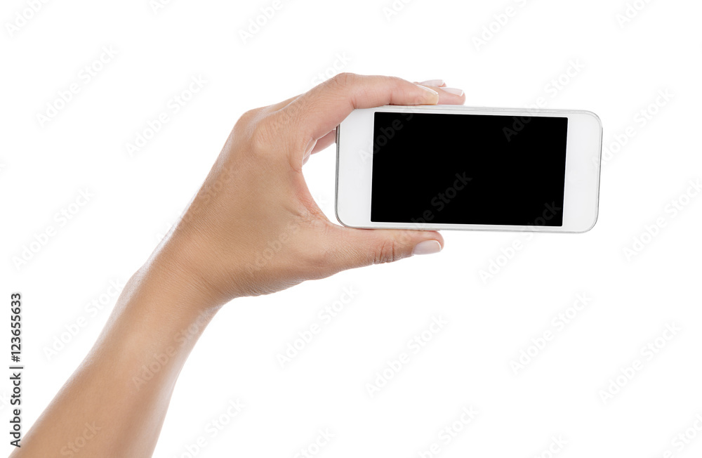 Female hand holding mobile smart phone with blank screen isolated on white background. Female hand holding mobile smart phone with blank screen isolated on white background.