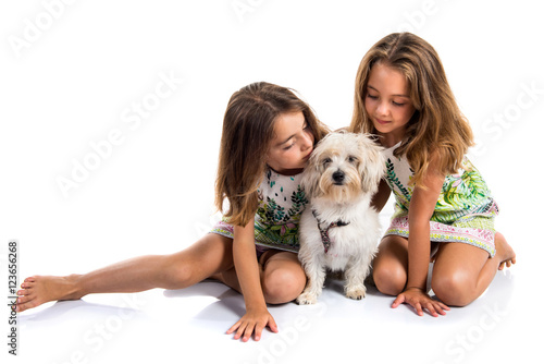 Twin sisters with his dog