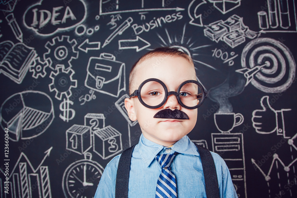 Little boy as businessman or teacher with mustache and glasses standing on dark background pattern. Wearing shirt, tie. close-up