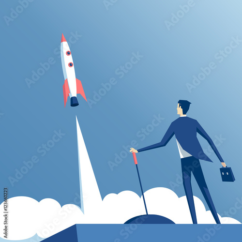 businessman launches rocket into the sky, employee performs the start-up of the spacecraft. Business startup concept