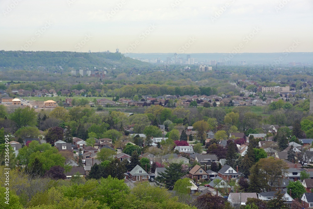 view from the Devils Punch bowl lookout point towards the  Stoney Creek community and Hamilton in the far background,  Ontario Canada