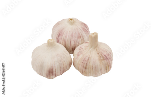 Three cloves of garlic. Isolated on white background