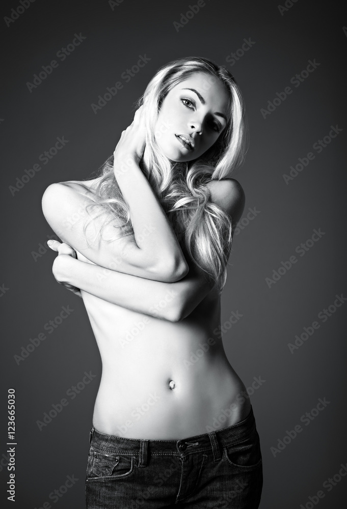 Studio fashion shot of sexy young woman. Black and white