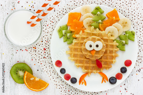 Creative idea for kids breakfast wafer with kiwi banana orange