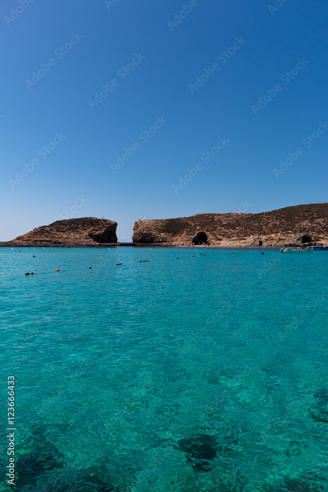 Island seen from the sea with a turquoise water