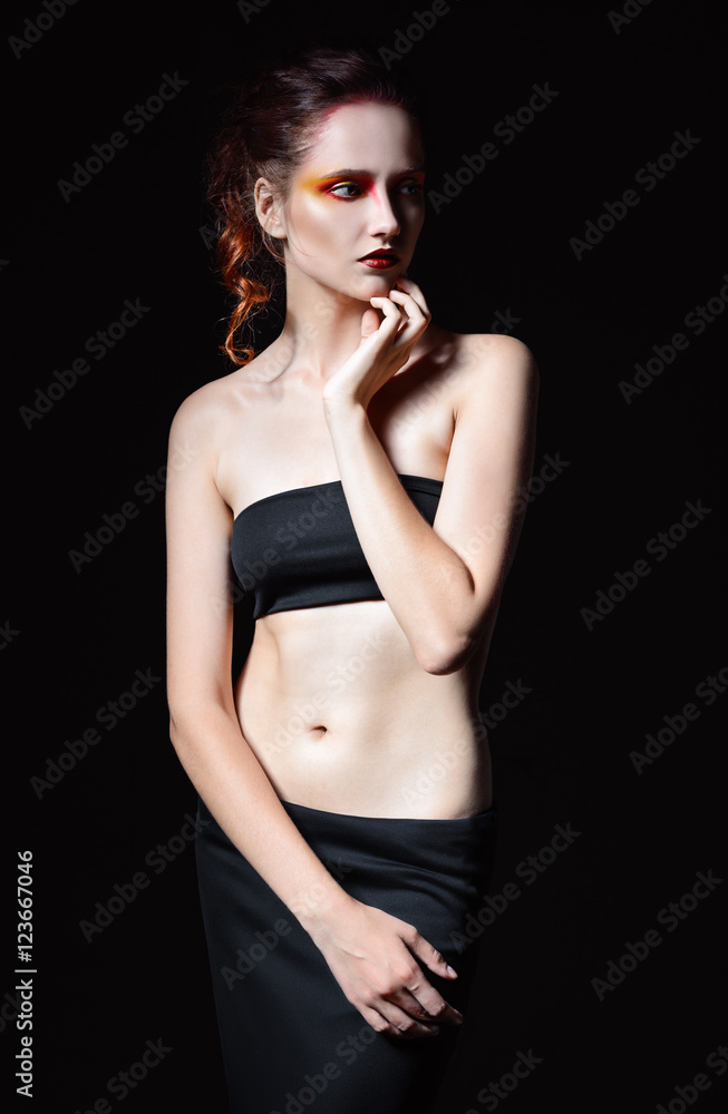 Fototapeta premium Dramatic studio portrait of cute sad redhead woman