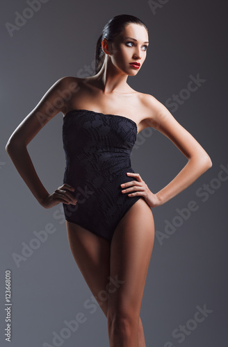 Studio fashion shot: beautiful young woman wearing black body © jetrel2