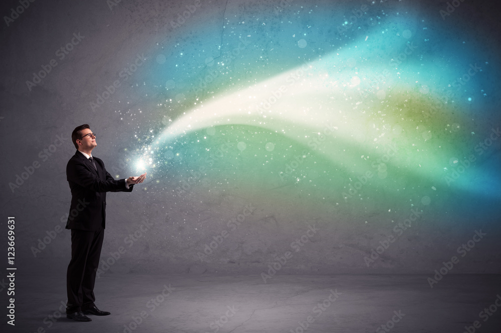 Businessman holding light Businessman holding light