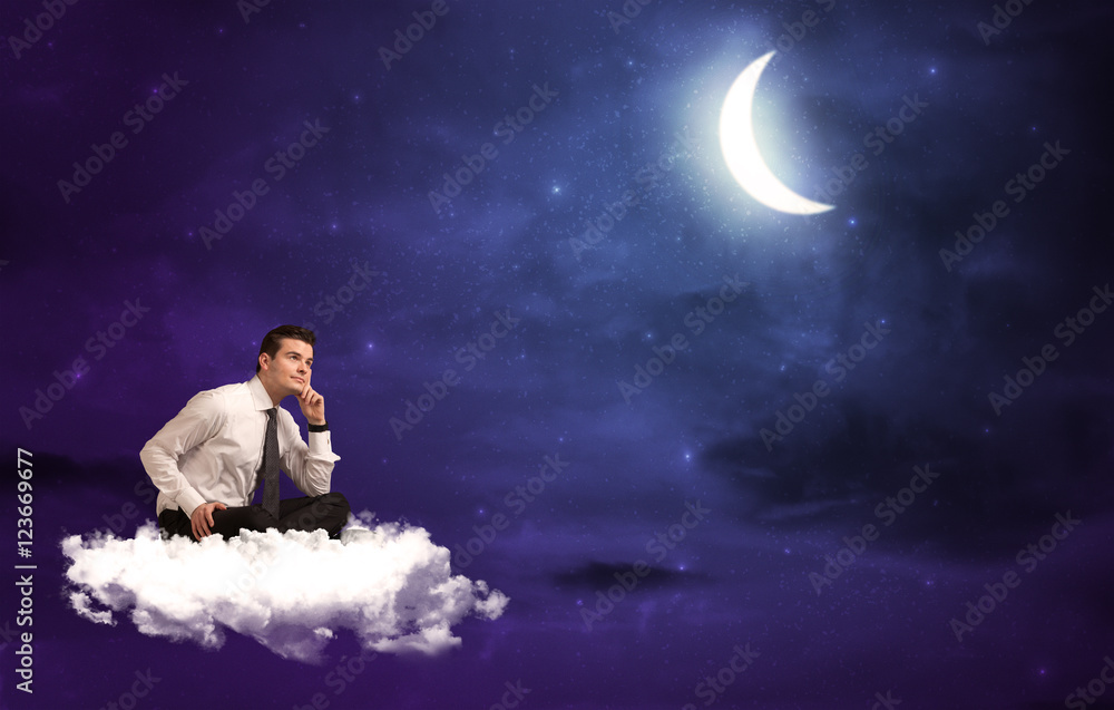 Obraz premium Man sitting on cloud