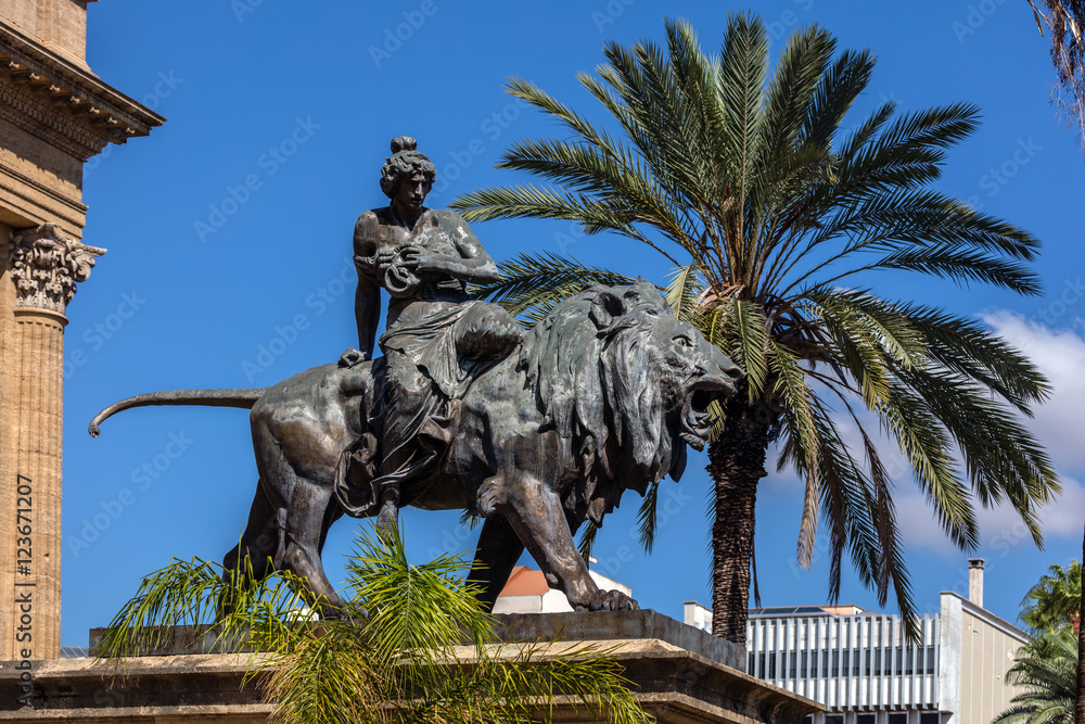 Naklejka premium 19th century bronze statue representing the Lyric seated on a lion by Sir Mario Rutelli, located next to the Massimo Theater's entrance staircase in Palermo, Sicily.