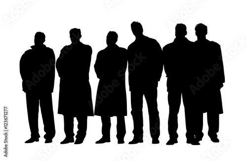 Group of business people in winter coats and jackets at a meeting