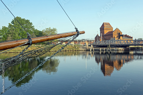 Drehbrücke in Lübeck mit Bug eines Segelshiffs im Vordergrund photo