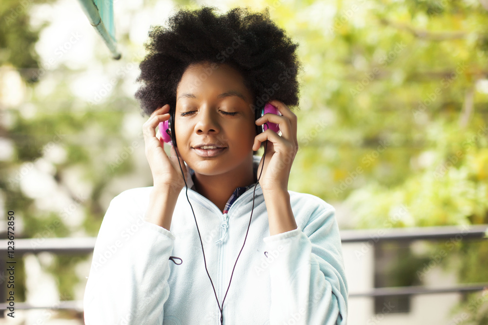 African american woman with headphones outdoors African american woman with headphones outdoors