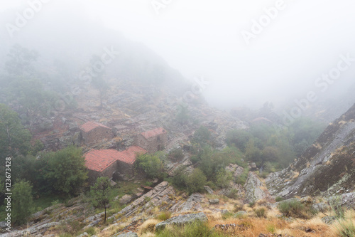 Landscape with fog in Penha Garcia. Portugal.
With old water mills. photo