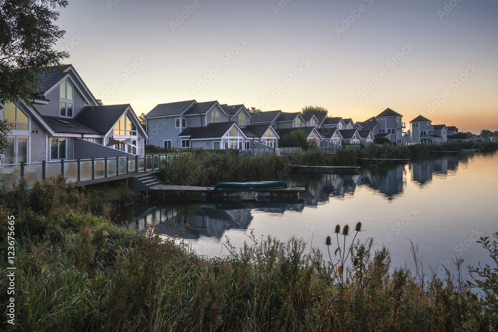 Stunning dawn landscape image of clear sky over calm lake