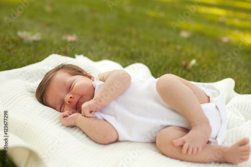 Baby sleeping on the grass