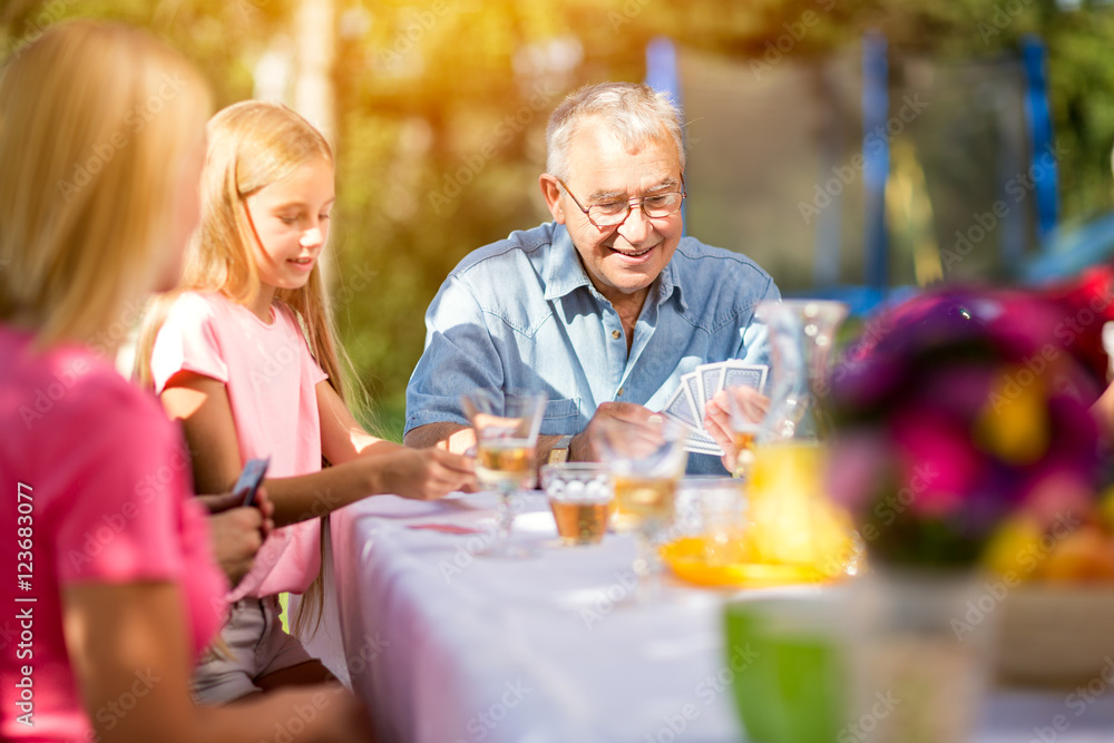 grandfather playing cards outdoors. grandfather playing cards outdoors.
