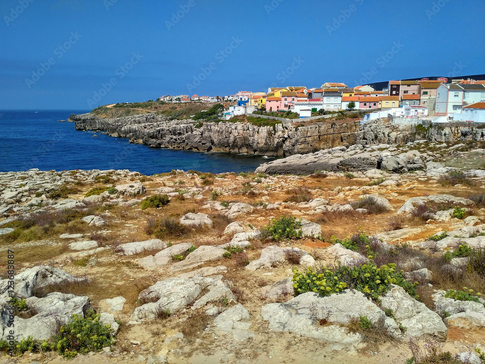 View to the bay with rocks and houses in Peniche, Portugal