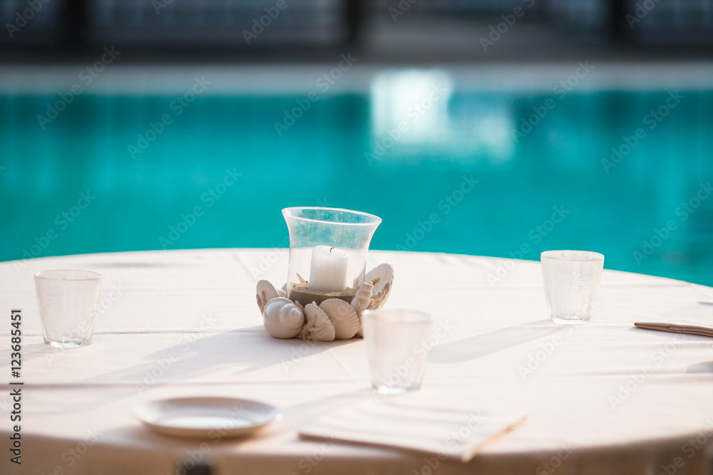 Lunch time. Empty table in restaraunt outdoor background pool Lunch time. Empty table in restaraunt outdoor background pool
