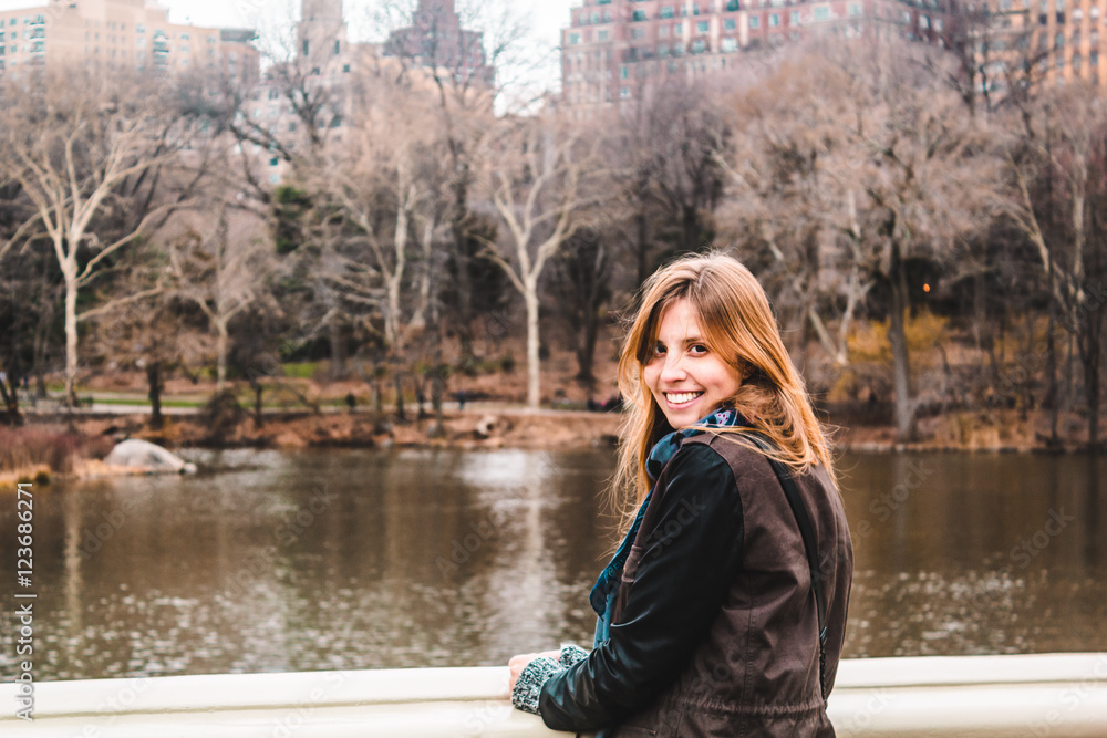 Girl in front of trees at the Central Park in Manhattan, New Yor