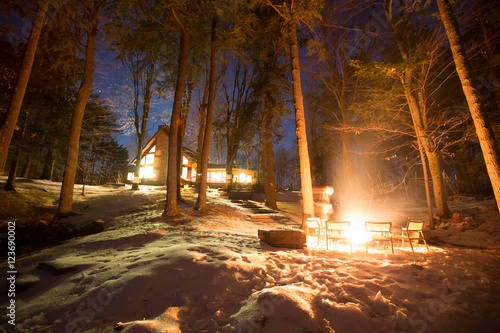 long exposure campfire during winter by the cottage