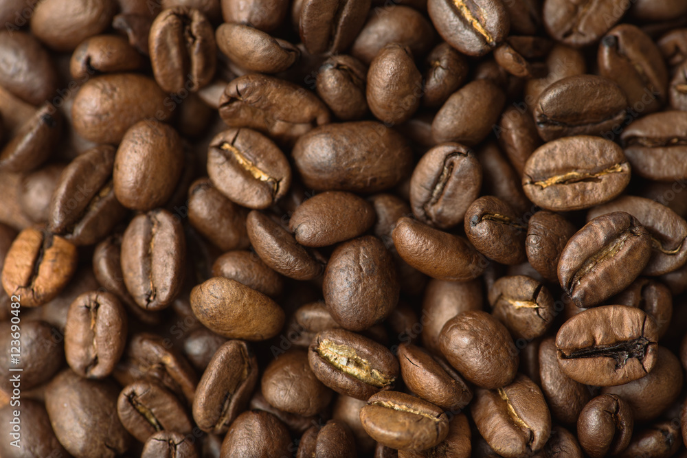 Brown coffee beans, closeup macro for background and texture Brown coffee beans, closeup macro for background and texture