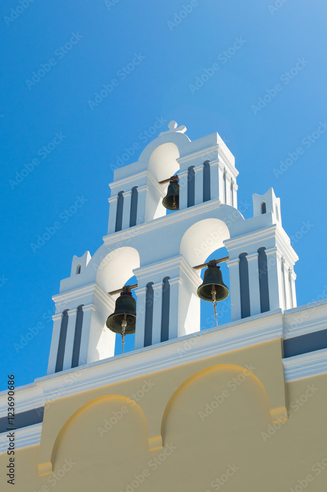 White orthodox church bell tower. Oia, Santorini Greece. Copyspace